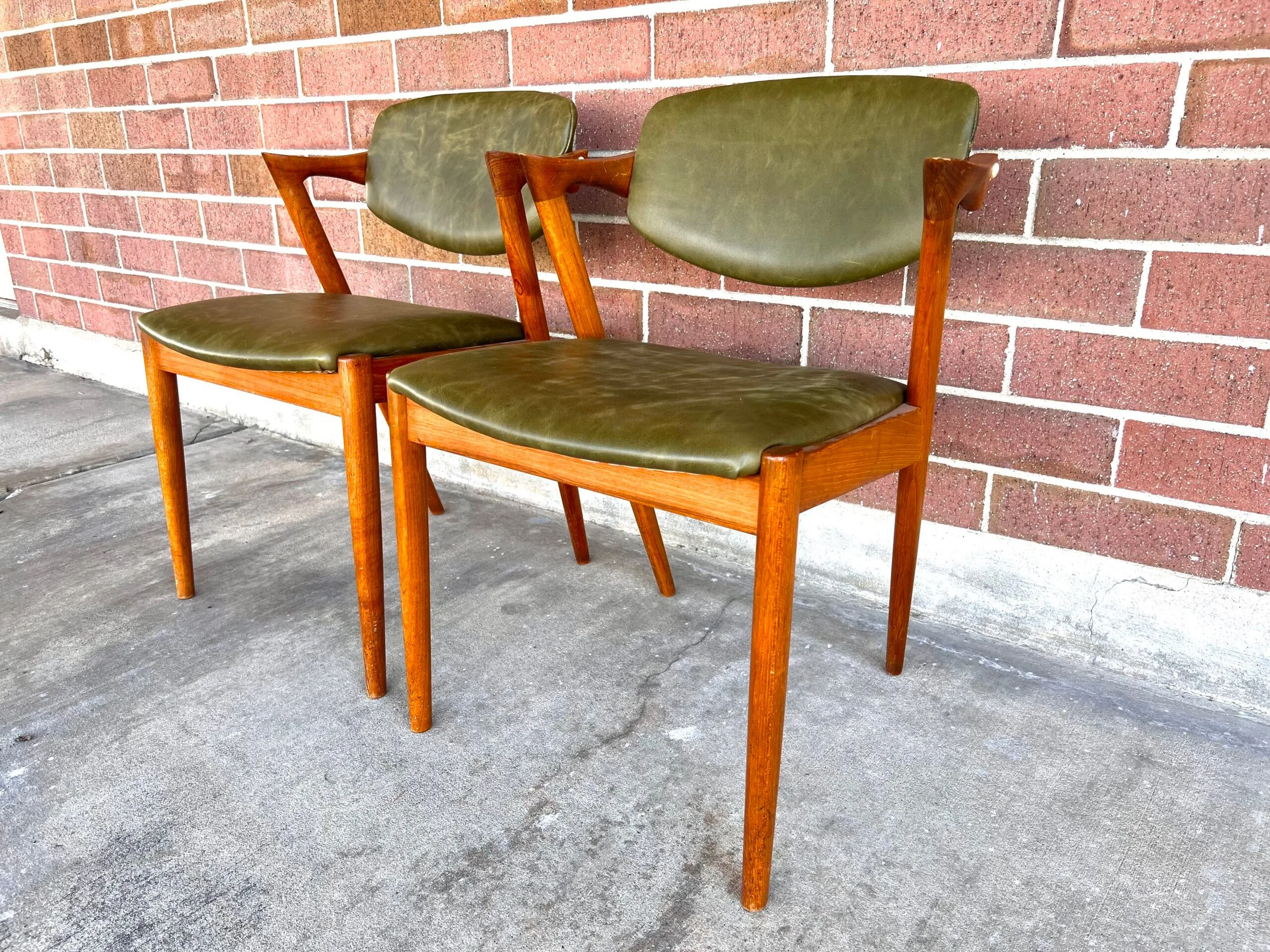 Pair of Danish Kai Kristiansen dining chairs in olive green leather