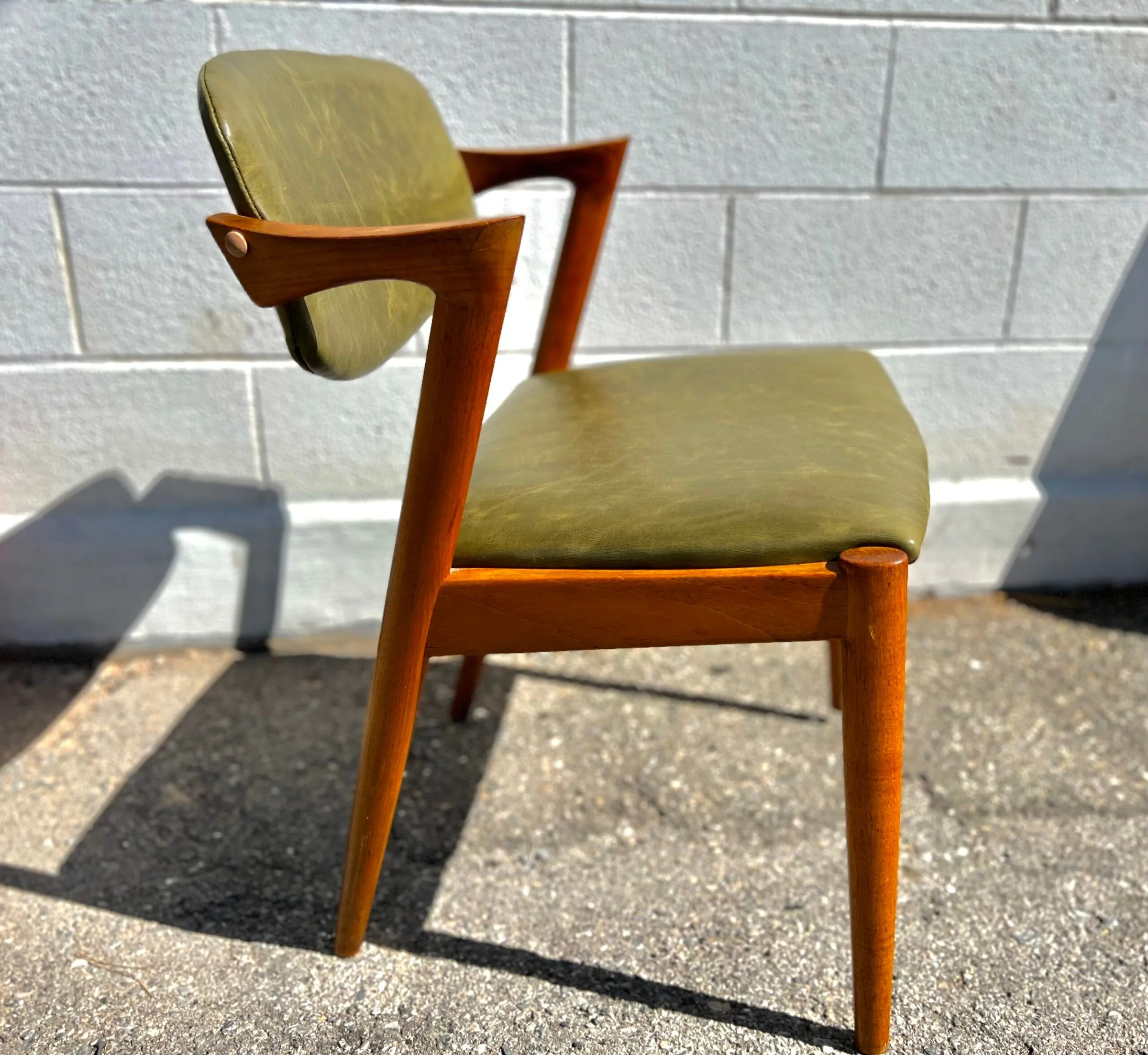 Danish Kai Kristiansen armchair reupholstered in olive green leather